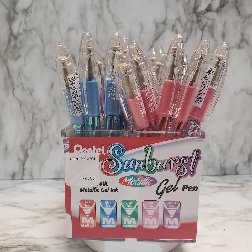 A box of pens sitting on top of a counter